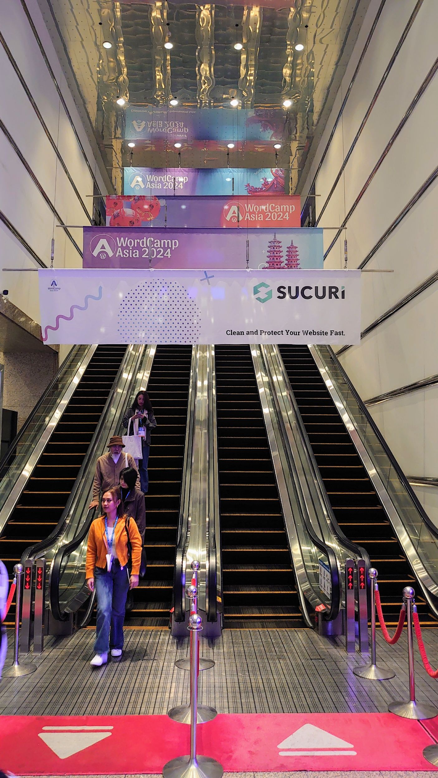 Sponsor add-ons - Hanning banners on escalators - one for Sucuri